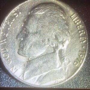 Silver Coin with Textured Matte Finish and Detailed Relief